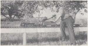 Wally Ribbeck at the controls of his Hudson. Wally's automobile furnishes blower air to start fires in his and Bill Michaels' engines until engines' blowers take over. Fall 1948.