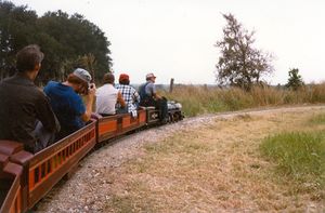 John Smyth running his Pacific at the Annetta Valley & Western Railroad. This was taken in the late 1970's on the earliest version of the AV&W. John's son, Carrie, is in the white short-sleeve shirt. Terry Shirley is in the blue shirt taking the photograph. Photo provided by Terry Shirley.