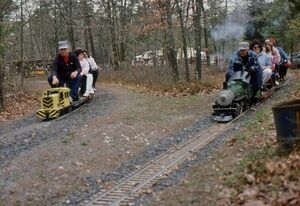 John Maddox Jr. on his father's engine, a Cannonball "Little Gasser" (had a 3hp gas engine). The engine on the right is Al Heller on his Atlantic. South Haven Park, Suffolk County, NY 1987