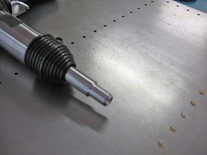 I turned the diameter of the tip of this rivet set to a smaller size so it would fit under the lip formed in the top of the side panel. Before I had to hold it at an angle to the head of the rivet which produces "smileys" on the panel. Not good