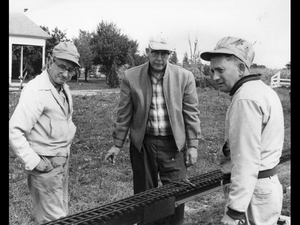 Frank Birch, Jack Prest and Jack Hart having a discussion. Jack Prest was the BLS Secretary for Canada at the time until his untimely passing. Taken at the Windsor Ontario track.