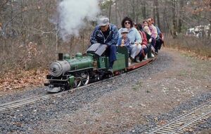 Al Heller (who became the club President) and his coal fired Atlantic "Big Green". Long Island Live Steamers, South Haven Park, Suffolk County, NY 1987