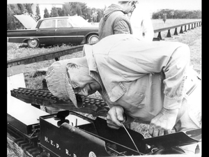 Henry E Peotter and his locomotive. His initials were used to identify his railroad on the tender.