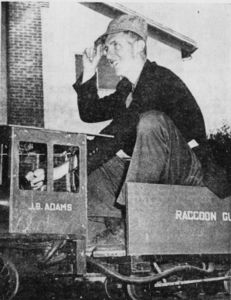 Novice Engineer Dick Steinheimer, Independent-Journal reporter-photographer, takes the throttle of the J.B. Adams on a slow trip around the one-fith mile track of the home of Mr. and Mrs. Gordon B. Adams of Fairfax. The photographer was adjudged to have failed his student trip because of knees hanging out of the tender.