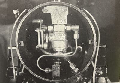 This photo shows how the linkage is attached to the throttle and the throttle arm positioned outside the smokebox. The throttle is shown in the closed position.