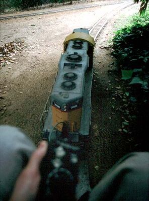 A driver's view of the engine, coming out from the shade under the trees into the California sunlight...