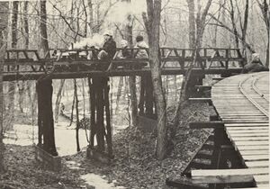 Tom Patton rolls his CliShay across Trestle #1 while Paul Fitt can be seen through the bents, rounding the curve at Wood Lot Siding...twenty feet below.