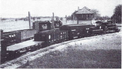 Some of the railroad's rolling stock is visible in this photo. Locomotive #723, an Allen Models Ten-Wheeler, heads up the consist in the foreground while two Railroad Supply Corporation GP-40s, #5321 and #3119 (dummy) handle freight on the outer loop.