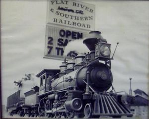 The propane powered Mogul pauses in front of the road sign for the FR&S. Note the engine house visible in the lower right corner of the photo.