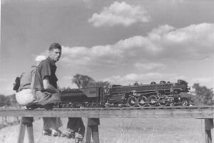 Here is another picture of the Douglas Massie Northern. It is being driven by his son Merideth Massie at the track in Montreal. This picture shows the engine with the original boiler, Coventry power reverse and steam driven cylinder drains. The drains at this time were using the steam one that fed the Harry Sait pump that used to be under the smokebox door. This picture would have been from one of the BLS meets in the 1940's.