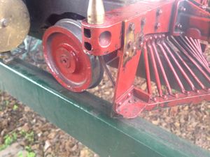 This photo shows the cattle guard bent from a derailment. This caused a brace to curve down onto the flange of the pony truck.