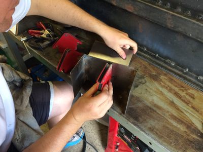 I decided to model the caboose after the Santa Fe caboose #999187 located at the Comanche & Indian Gap Railroad railroad. I needed a battery box in place of the tool cellar. Here my nephew Stephen is setting up to weld the box together. Note that this battery box was built from scratch, and is not part of the Kitsap Live Steamer's kit.