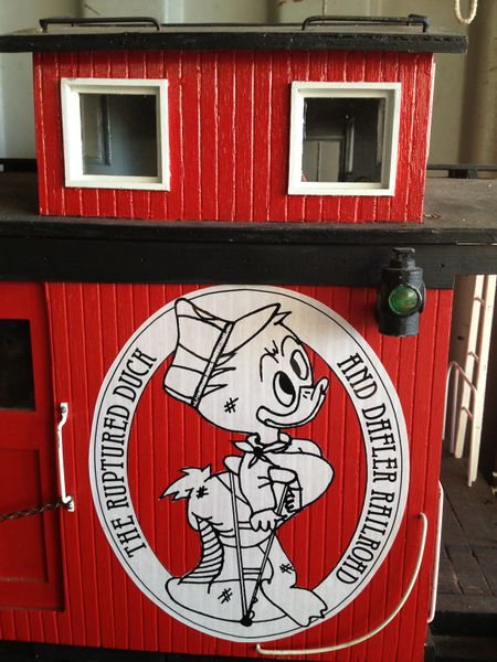 File:TheRupturedDuckAndDaflerRailroad herald.jpg