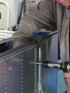 Here you can see that the rivet set goes right over the tape when bucking. Tape is peeled off each row as it is finished. Using the tape makes the process go incredibly fast with a lot less effort. I got the tape from Aircraft Tool Supply Company.